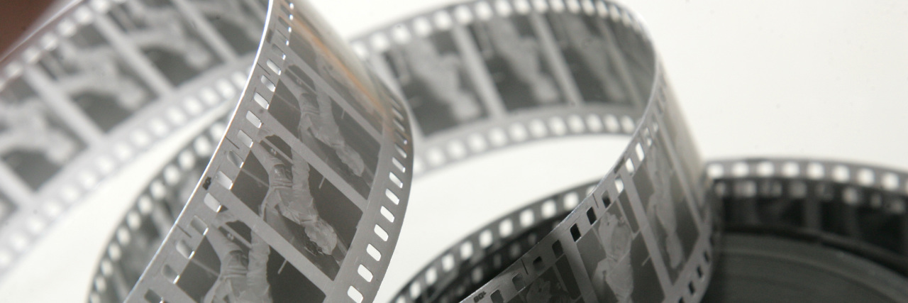 Examining Hollywood's Lack of Disability Diversity Black and white film strip.