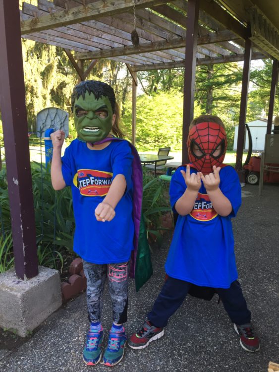 The author's two sons in superhero costumes and masks