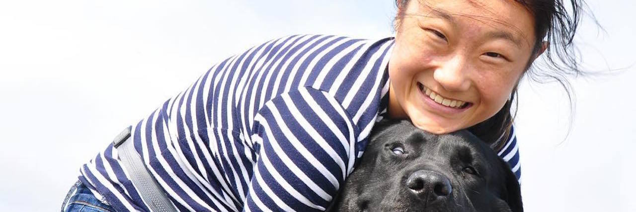 The author and her dog at the beach