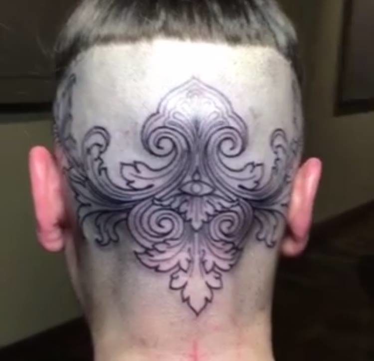 tattoo design on base of head with hair shaved
