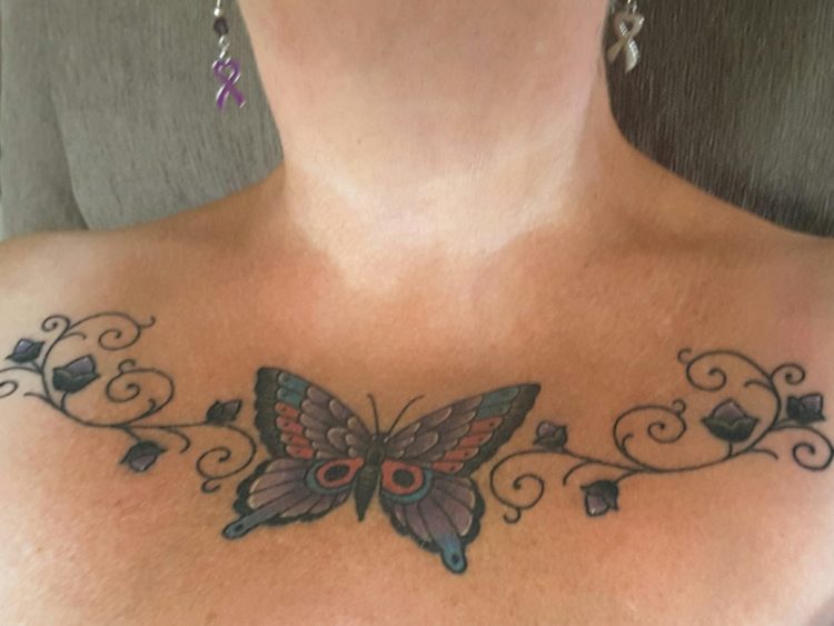 butterfly and vine tattoo design on chest