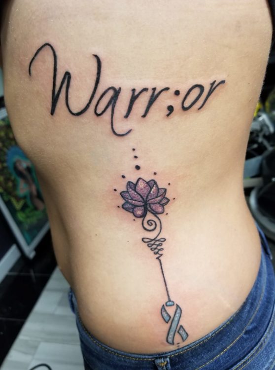 tattoo of warrior and flower design