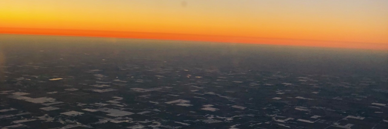 Problems Traveling By Air With Cerebral Palsy View through airplane window.