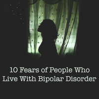 woman in darkness silhouetted against green tint window 10 Fears of People Who Live With Bipolar Disorder