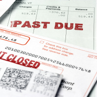 A stack of past due bill notices.