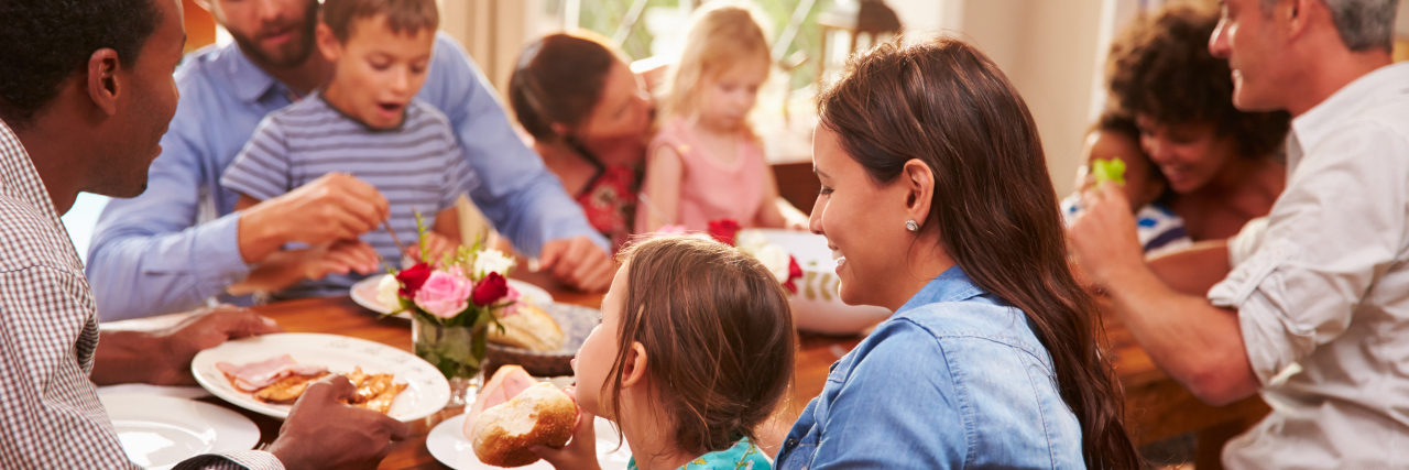 A Letter to Those Who Support Families of Medically Complex Children Family and friends sitting at a dining table