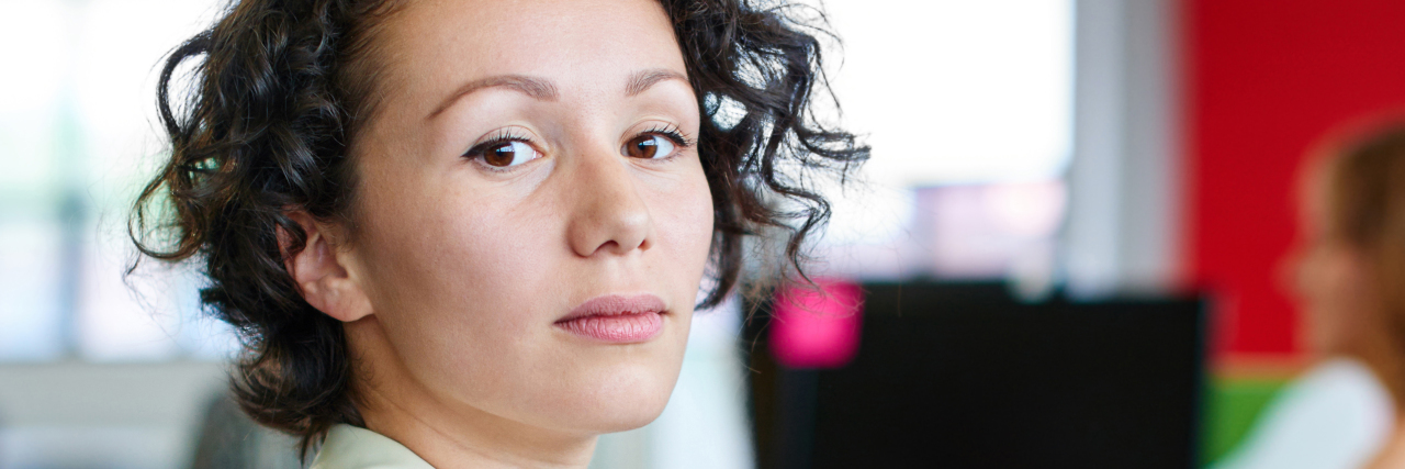 Breast Cancer and Taking Work Leave: Losing My Career Identity Confident female designer working on a digital tablet in red