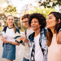 College students walking together outdoors.