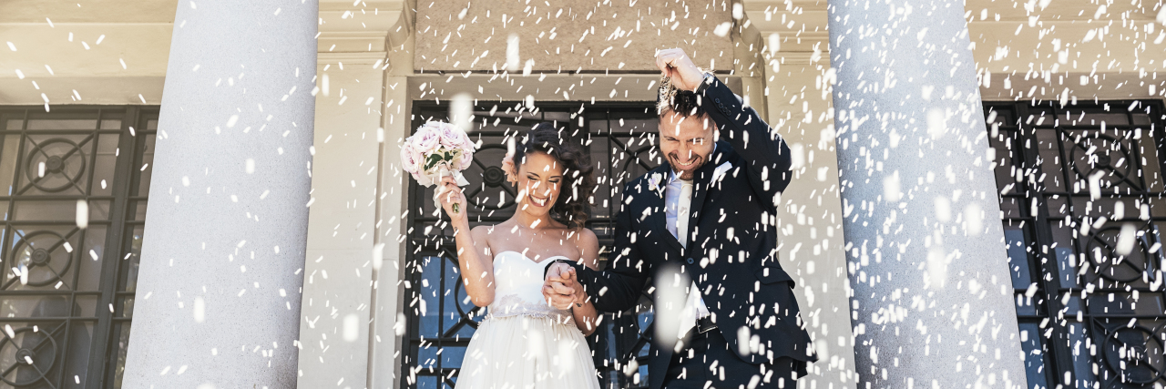 Why You May Want to Try Premarital Counseling Newly married couple leaving the church.