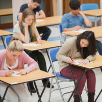 Students taking exam.