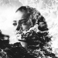 Double exposure of girl with gorgeous eyes and sea foam