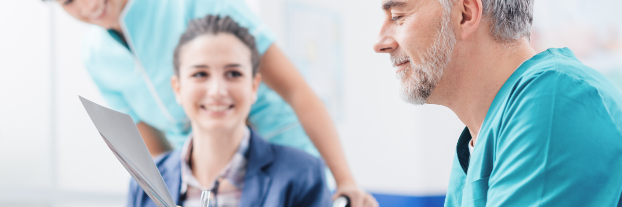 The Medical Community Is Changing the Way It Views Cerebral Palsy Doctors examining patient's medical records.