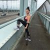 Hannah Gavios training for a marathon on a bridge in New York City.