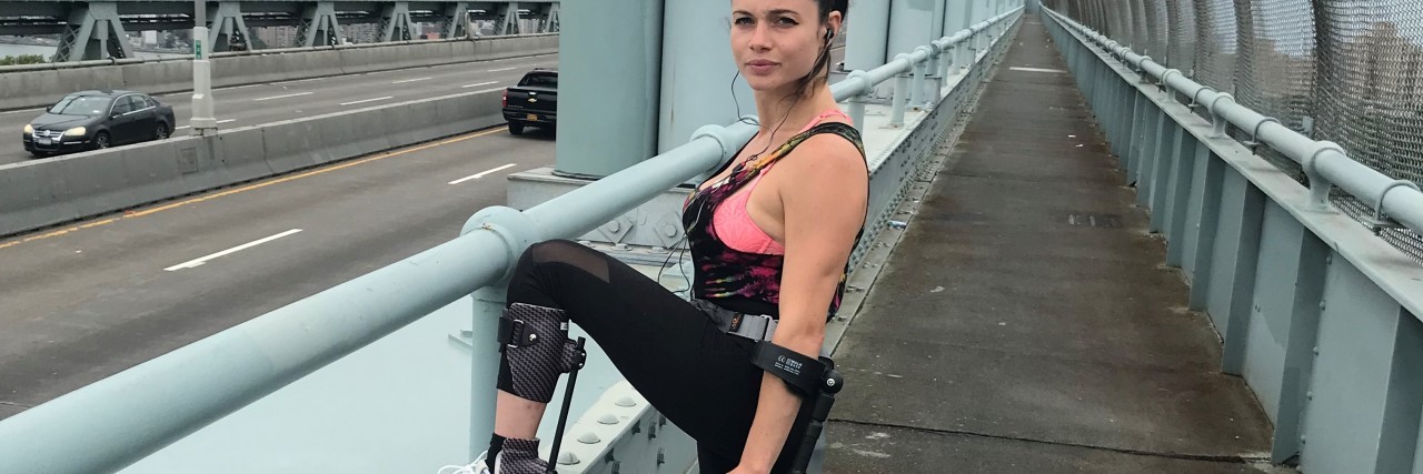 Crutching the NYC Marathon as a Woman With Paralysis Hannah Gavios training for a marathon on a bridge in New York City.