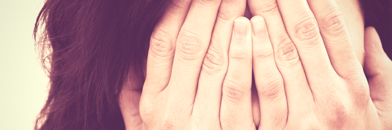 Coping Is Difficult for the Perfectionist With Crohn's Disease A picture of the writer holding her hands to her face.