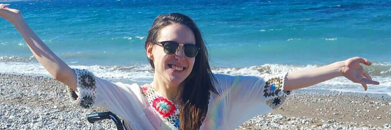 Cerebral Palsy Doesn't Define Me Rebecca on the beach.