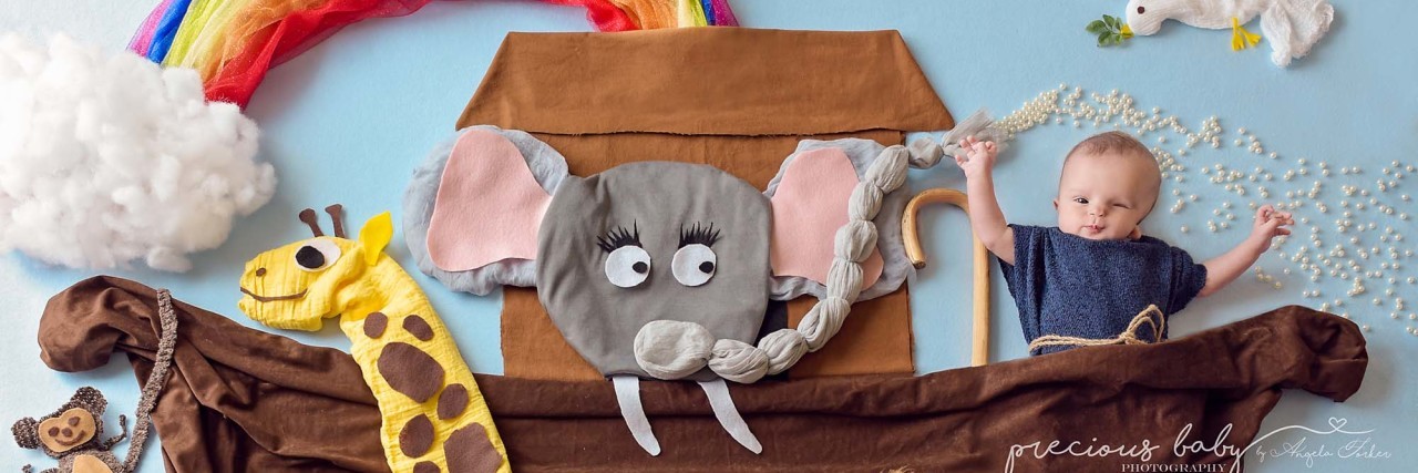 Angela Forker Photographs Babies With Disabilities in Beautiful Series Baby pictures in a "Noah's Ark" scene. Boat has a giraffe, an elephant, a lion and a rainbow.