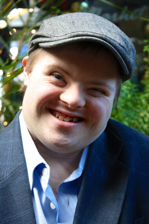 Headshot of Marcus Sikora smiling at camera.