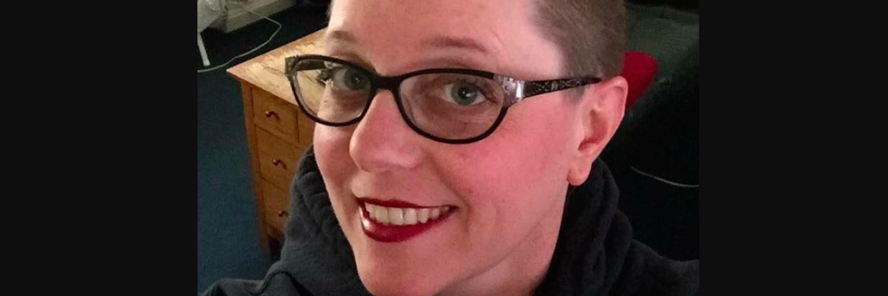 I Shaved My Head Like Rose McGowan in Honor of the #MeToo Movement woman smiling at camera with shaved head