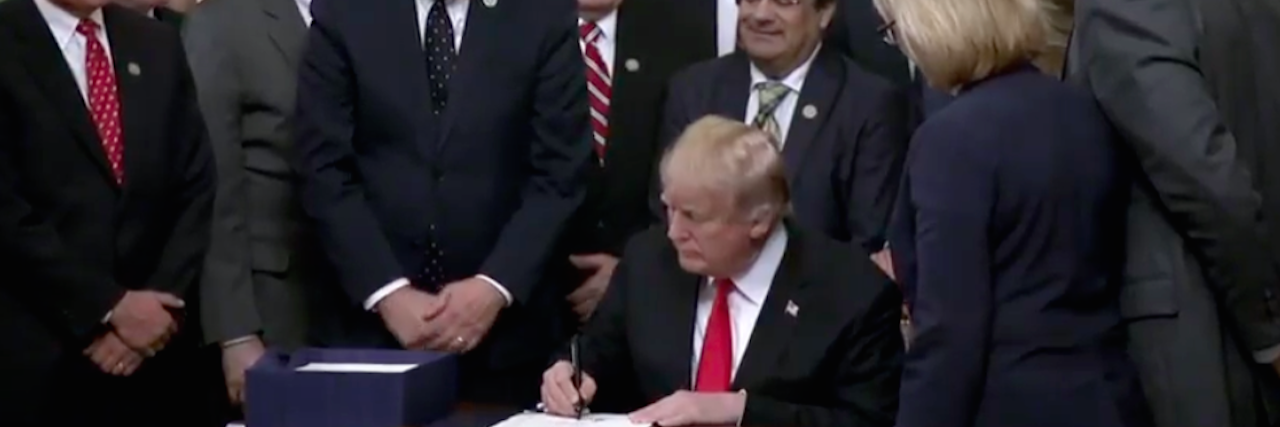 Trump Signs New Legislation to Fight Opioid Crisis trump signing bill
