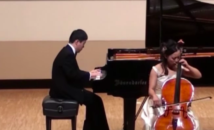 Ochi playig piano accompanied by a woman playing the chelo