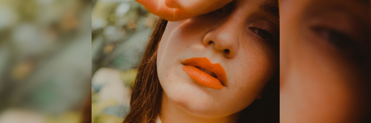 What It's Like Growing Up Numbing Your Emotions A woman staring blankly, her hand covering her eyes. Text over her picture reads: 18 Signs You Grew Up Emotionally Numb