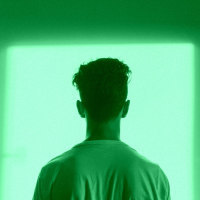 man staring out the door