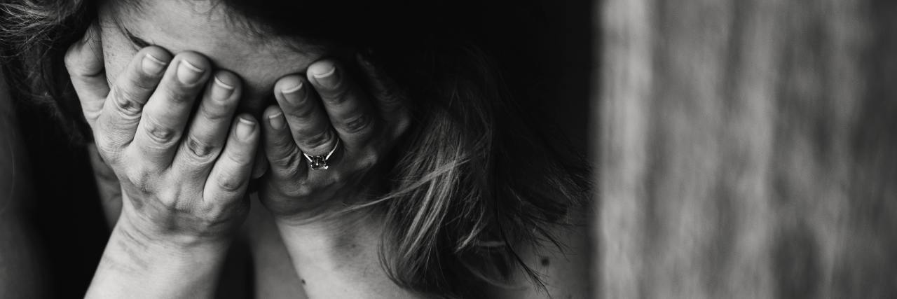 The Role Shame Played in My Depression black and white photo of woman with hands covering face depression