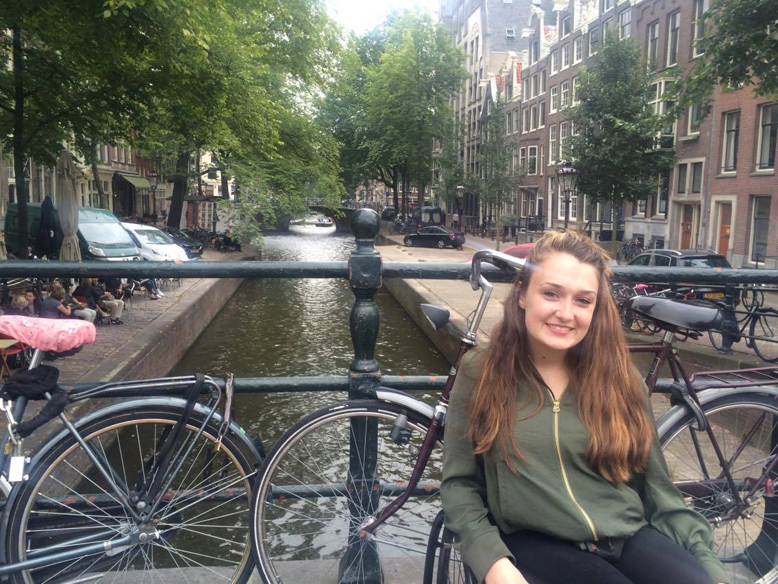 Shannon on a bridge in Amsterdam.