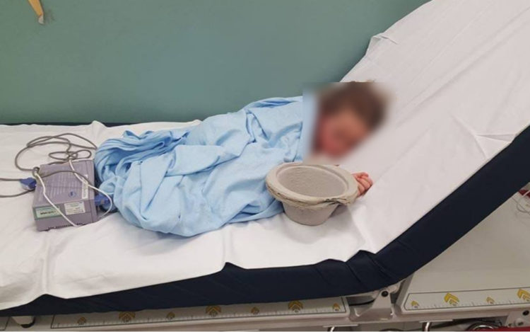 A child on a hospital bed
