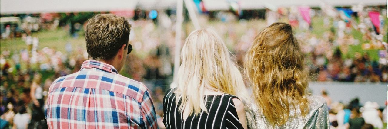 What My Favorite Person’s New Boyfriend Should Know About BPD photo of two women standing close together while man stands slightly at side , all facing away from camera