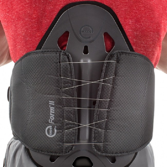 A person wearing an Exos Form II back brace by DJ Global