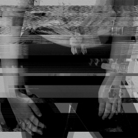black and white distorted image of a woman's hands
