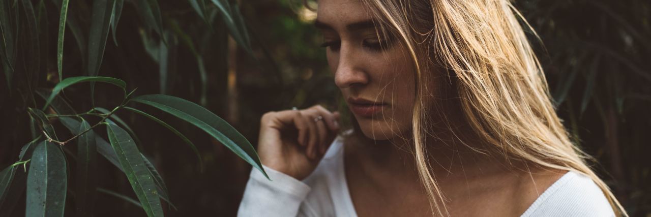 I've Just Got a Diagnosis of 'Quiet' Borderline Personality Disorder Photo of woman standing among corn or large plants with eyes closed