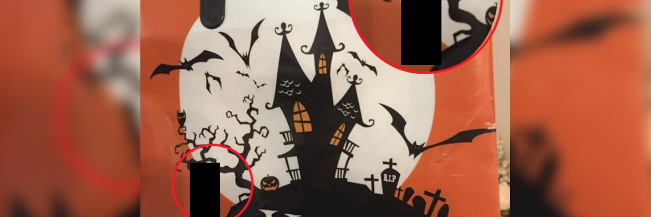 A trick-or-treaking bag with a haunted house