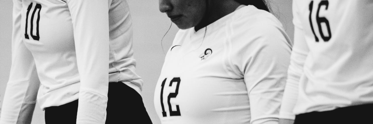 What Math Can Tell Us About Mental Health black and white photo of women holding hands with white shirts with numbers