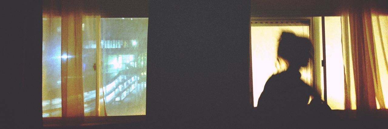 What It’s Like to Experience Schizoaffective Disorder Hallucinations blurred photo of woman silhouetted at window