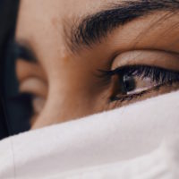 A woman with tears in her eyes