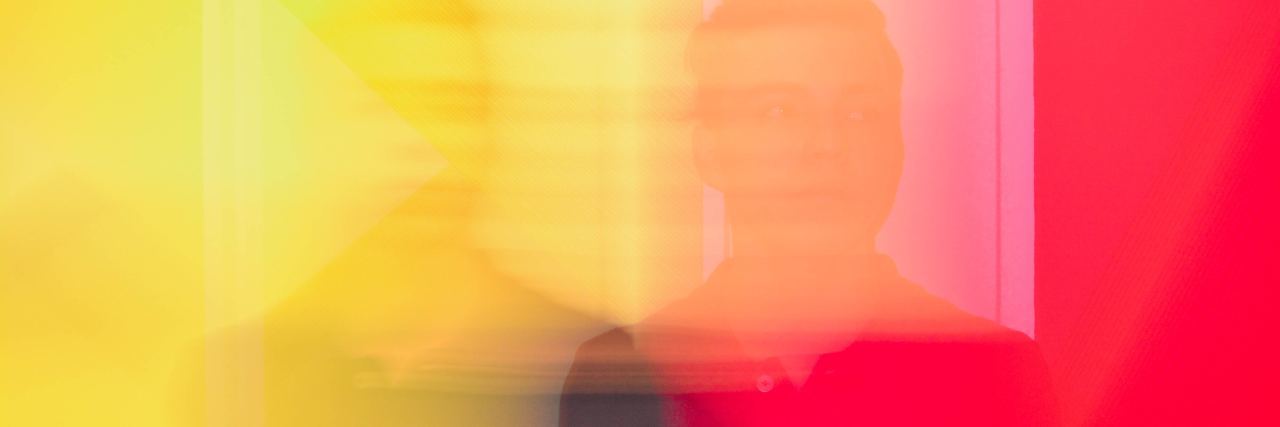 How to Cope With Anxiety and Avoidance blurred color photo of man standing looking at camera