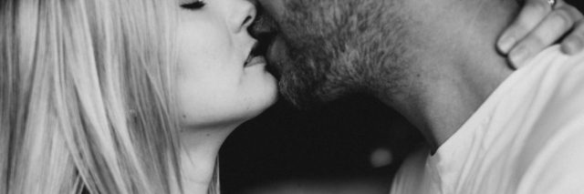 black and white photo of couple sensual kissing