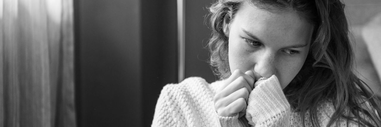 When You Feel Trapped in Your Mind by Depression and Anxiety black and white photo of young woman in distress