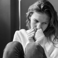 black and white photo of young woman in distress
