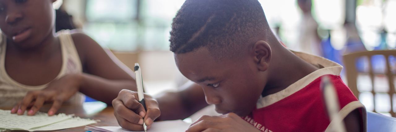 Why Homeschooling Because of Illness Can Be a Blessing kids working on schoolwork