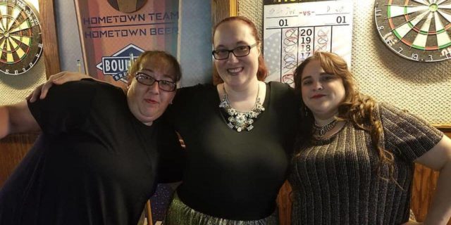 The author and her two friends smiling