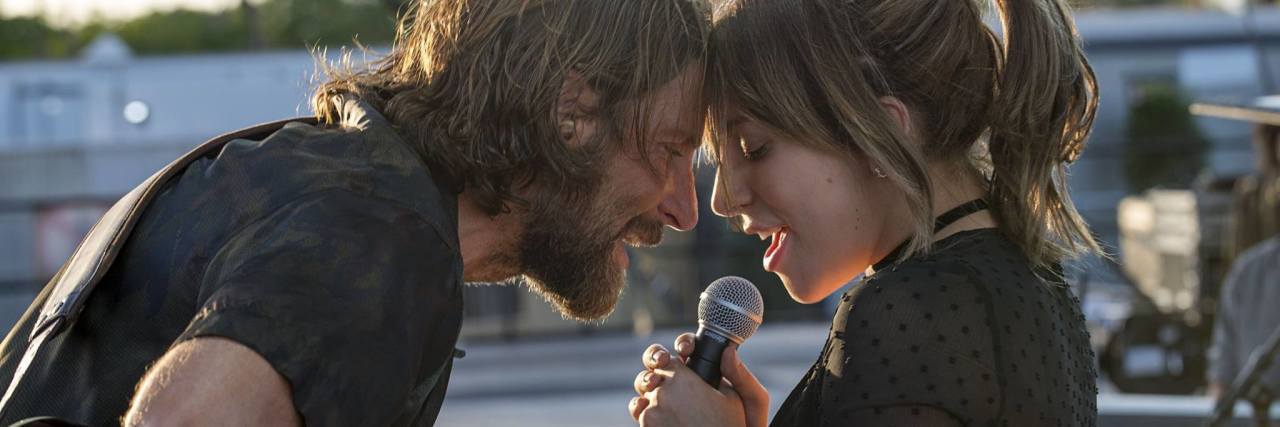 How 'A Star Is Born' Affected Me as a Suicide Attempt Survivor a star is born image showing lead characters singing to each other
