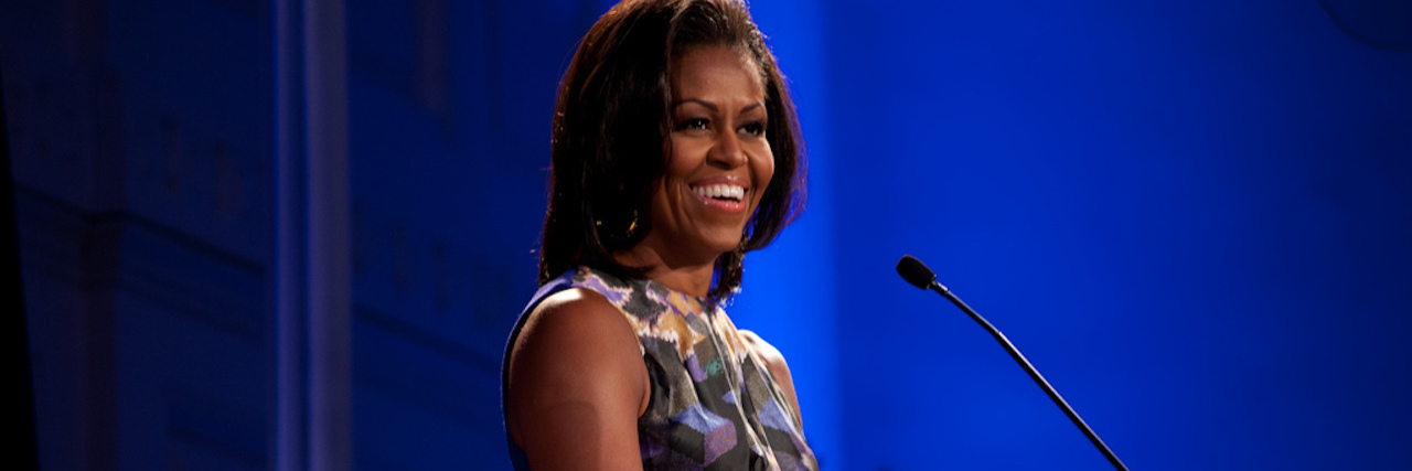 Michelle Obama speaking at a podium