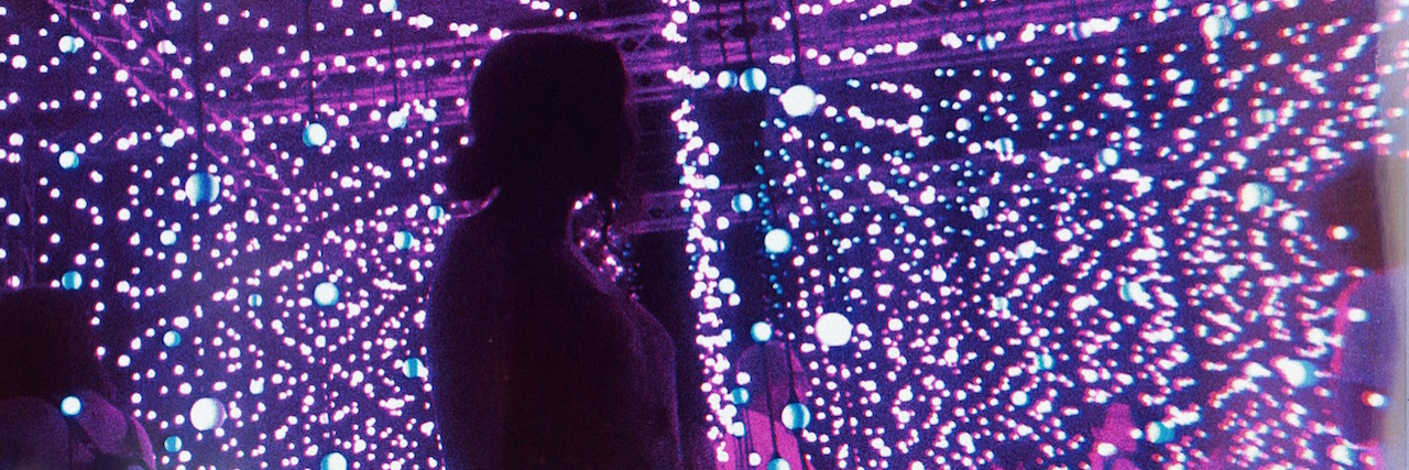 Talking to the Police After Rape A silhouette of a woman in front of purple lights
