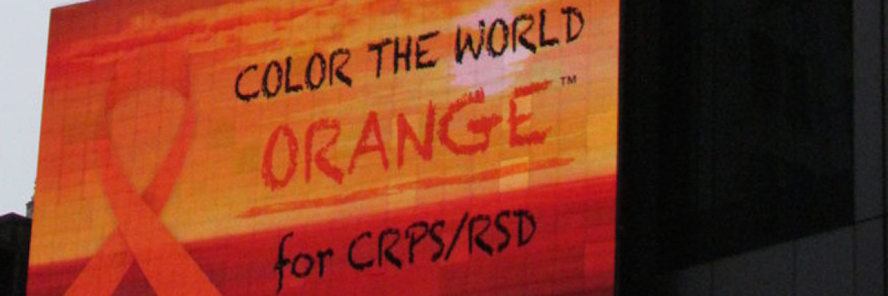 How to Raise Awareness for CRPS/RSD Awareness Month A billboard in Times Square With the "Color the World Orange" campaign