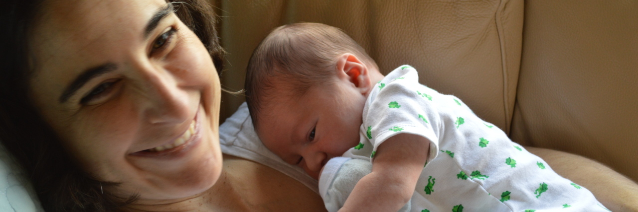 Choosing Parenthood With Juvenile Parkinson's Disease the author and her newborn baby