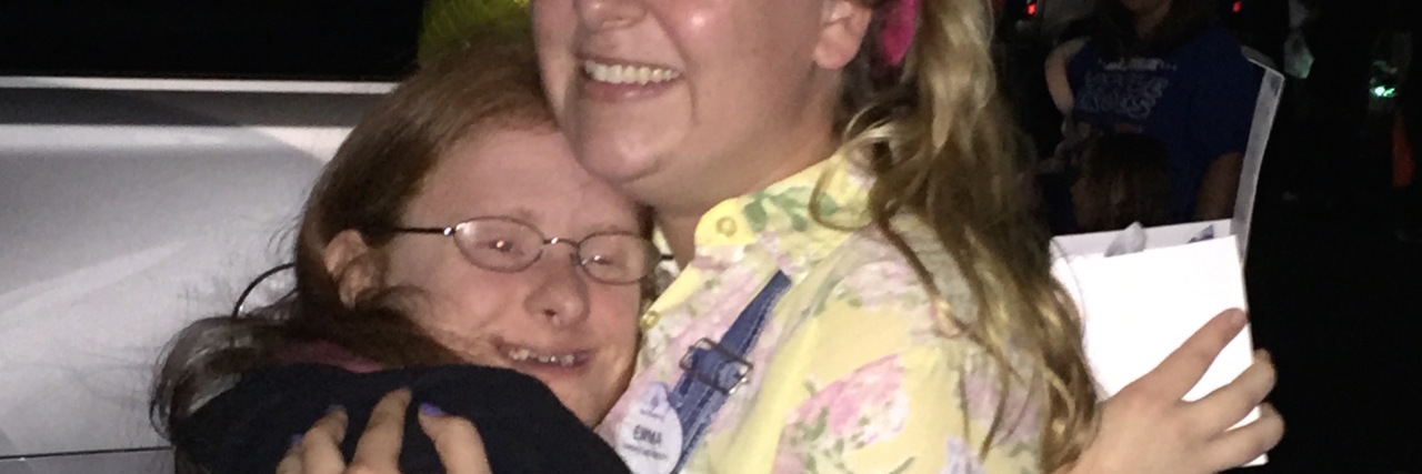 This Is Friendship for My Adult Daughter With Down Syndrome Two friends hugging.